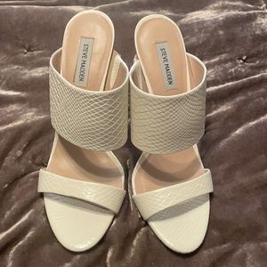 Steve Madden cream snake print mules.